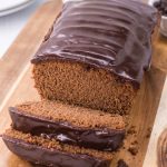 quick, easy triple chocolate bread shown on a brown cutting board and thinly sliced