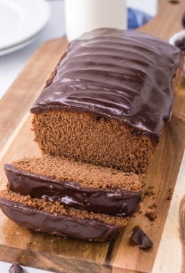 quick, easy triple chocolate bread shown on a brown cutting board and thinly sliced