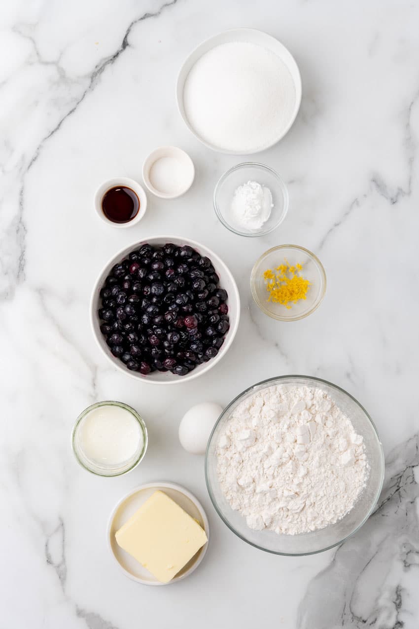 an overhead image showing the measured ingredients needed to make a buttermilk blueberry breakfast cake
