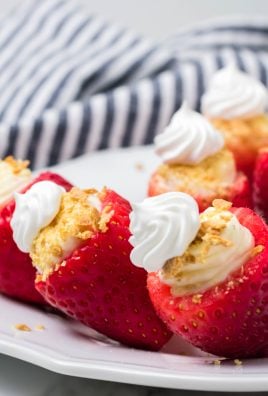 cheesecake stuffed strawberries on a white plate