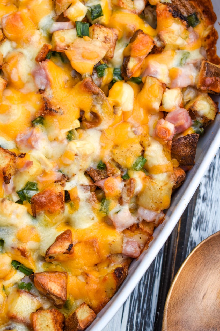 loaded baked potato chicken casserole in a white baking dish