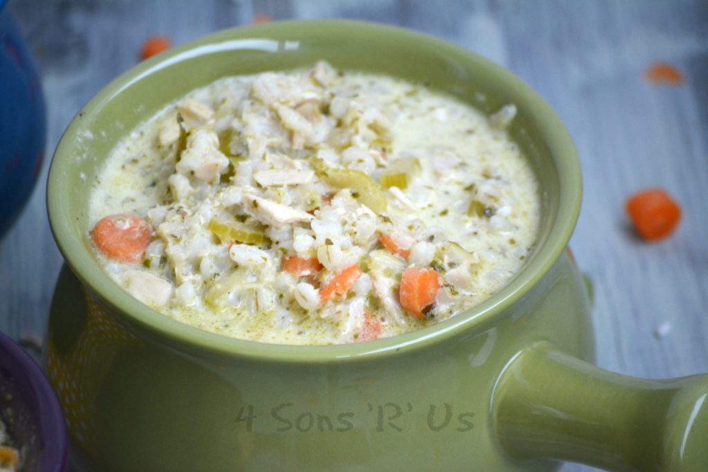 Crockpot Chicken And Pesto Soup in a green ceramic bowl