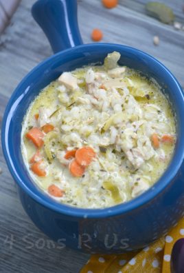 crockpot chicken and pesto soup in a blue bowl