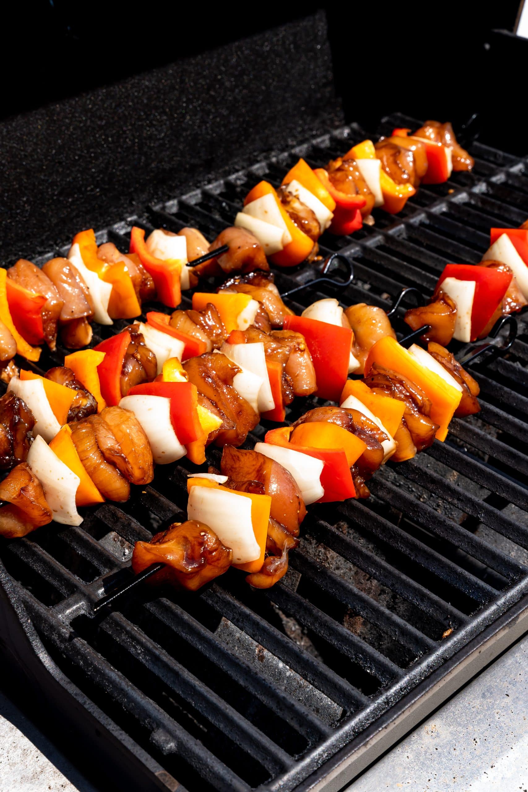 marinated chicken kabobs on a hot grill