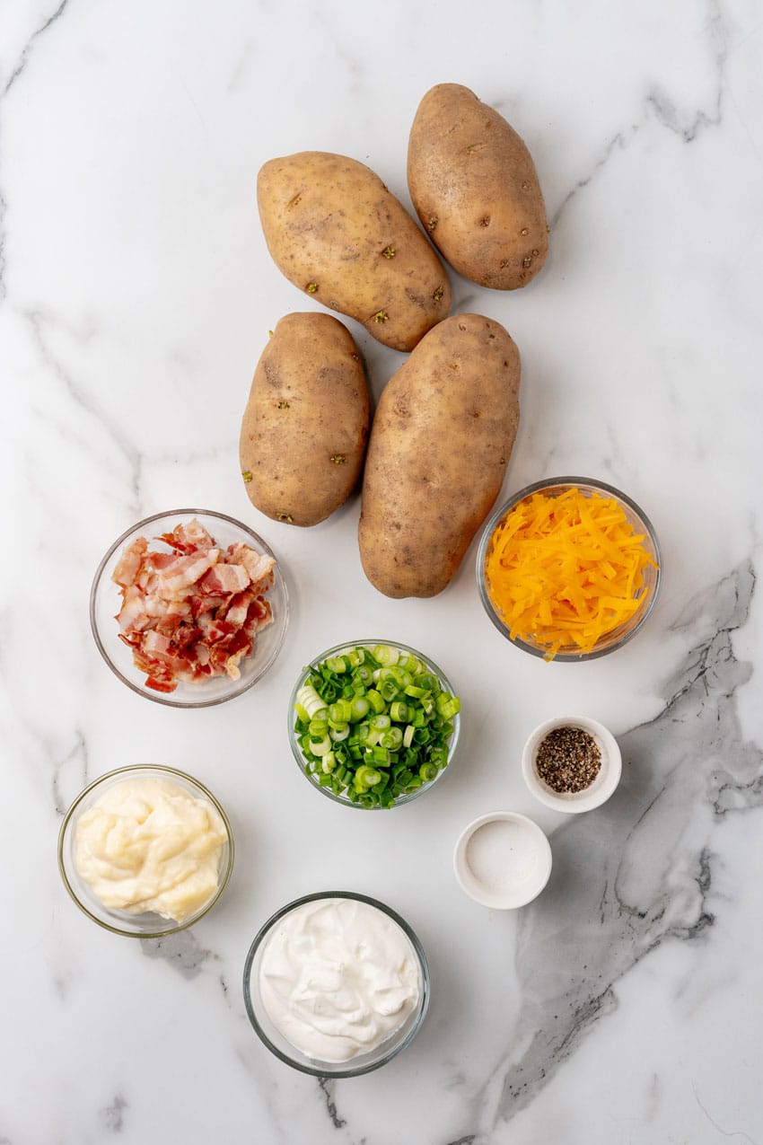 an overhead image showing the measured ingredients needed to make a batch of loaded potato salad