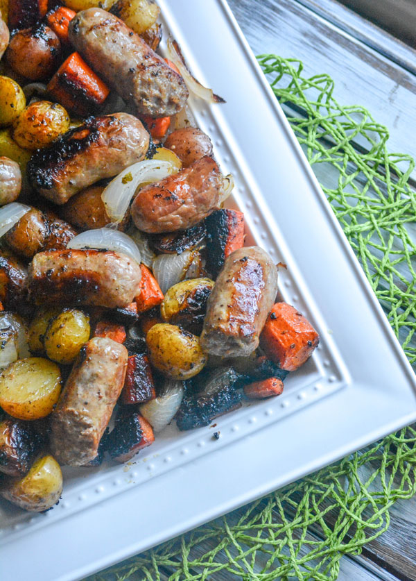 Quick & Easy Sausage and Vegetable Casserole on a white platter on top of a green place mat