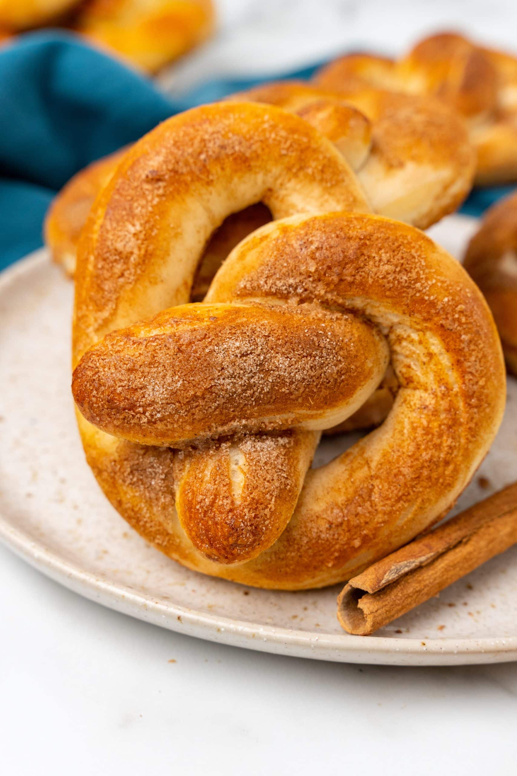 sugar sprinkled 30 minute soft pretzels piled on a white plate