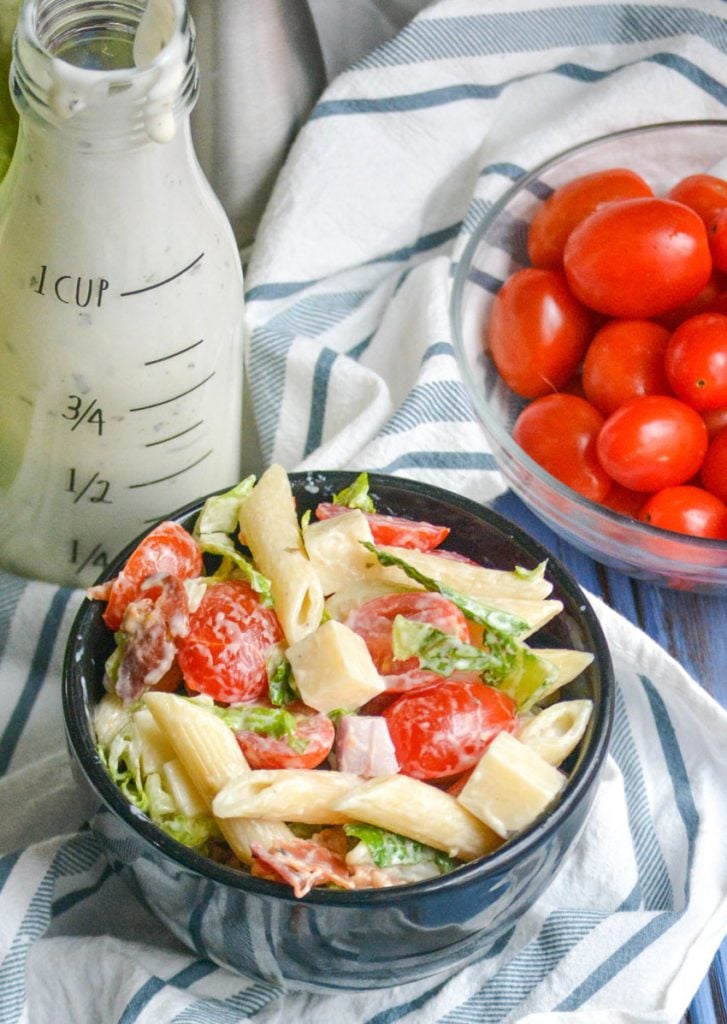 ranch blt pasta salad shown in a small black bowl