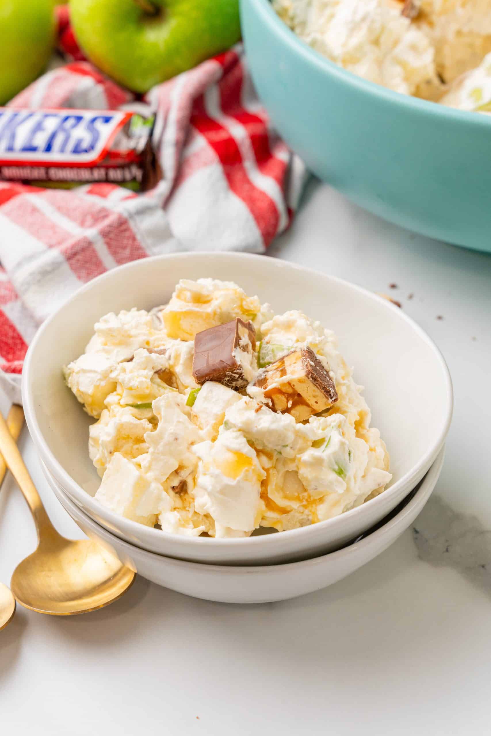 caramel apple snickers salad in a small white bowl