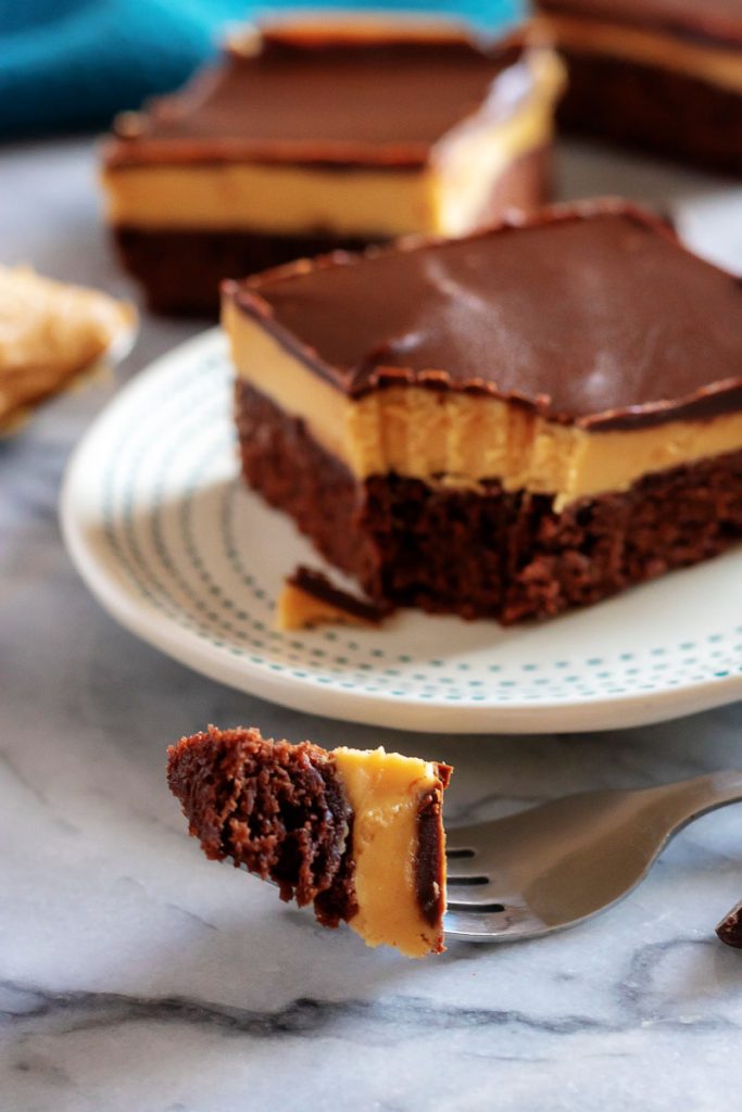 a fork full of a Buckeye Brownie with others in the background