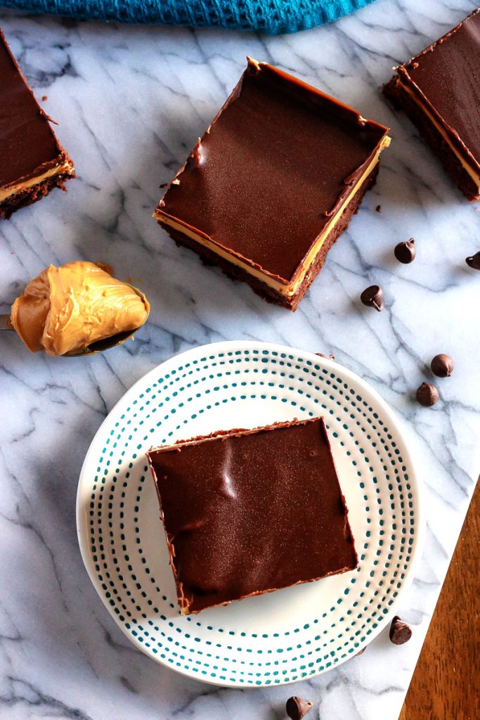 Buckeye Brownies, an above shot with a spoonful of peanut butter and some chocolate chips in the background