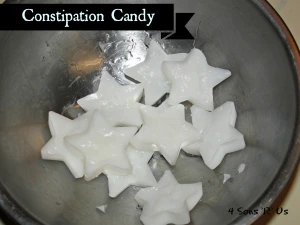 star-shaped white constipation candies in a metal mixing bowl