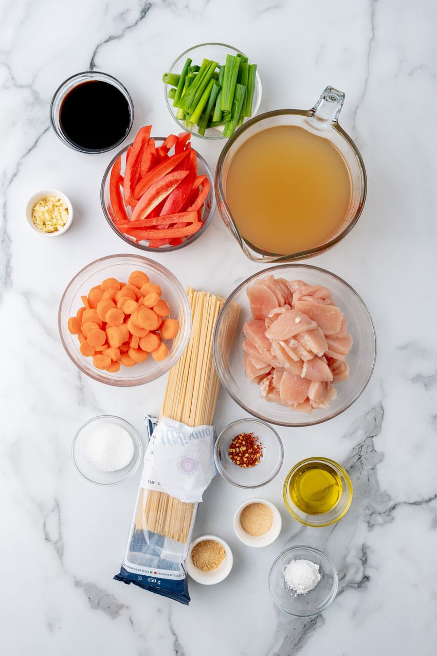 an overhead image showing the measured ingredients needed to make one pot chicken lo mein