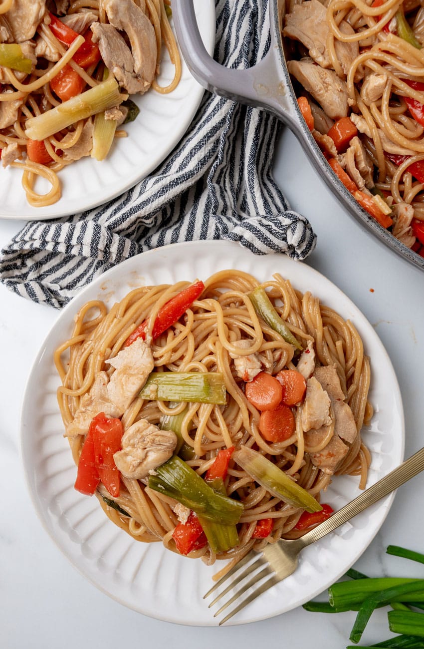 one pot chinese chicken lo mein pasta on two white plates