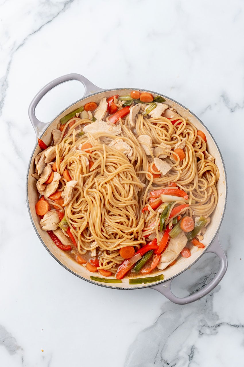 one pot chicken lo mein in a cast iron skillet