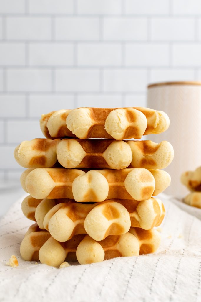 a stack of wafeltjes (Belgian waffles cookies) on a cloth napkin