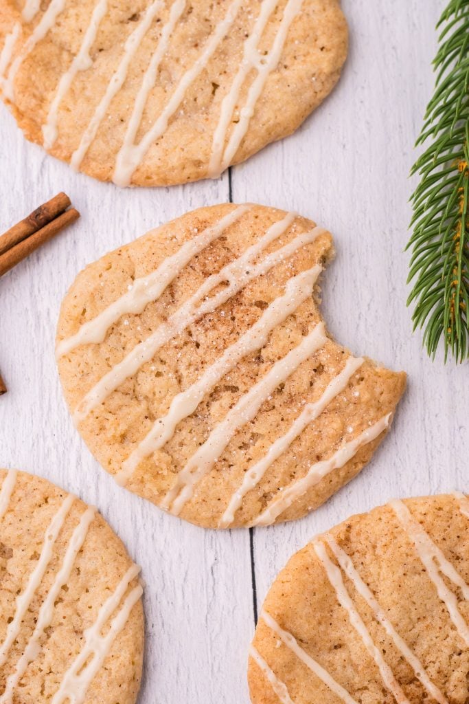 eggnog cookies laid out on a wooden table