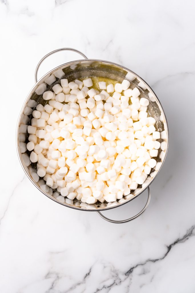 miniature marshmallows in a silver pot with melted butter