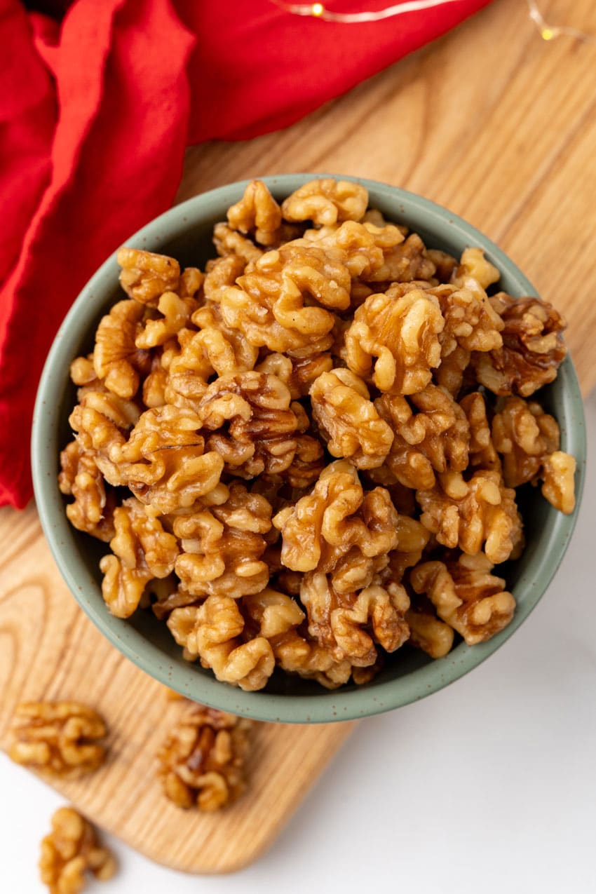 slow cooker maple walnuts in a small gray bowl