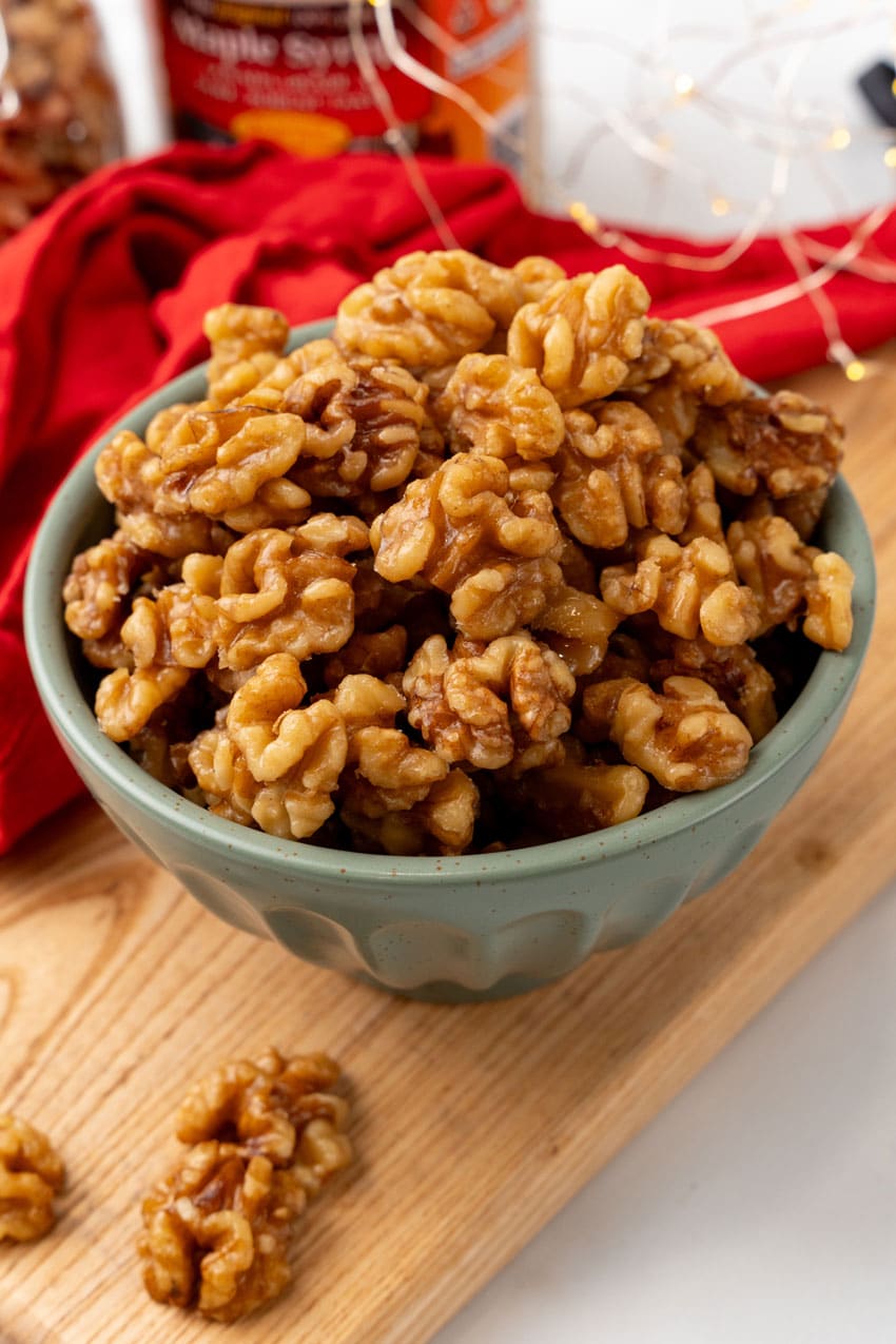 slow cooker maple walnuts in a small gray bowl