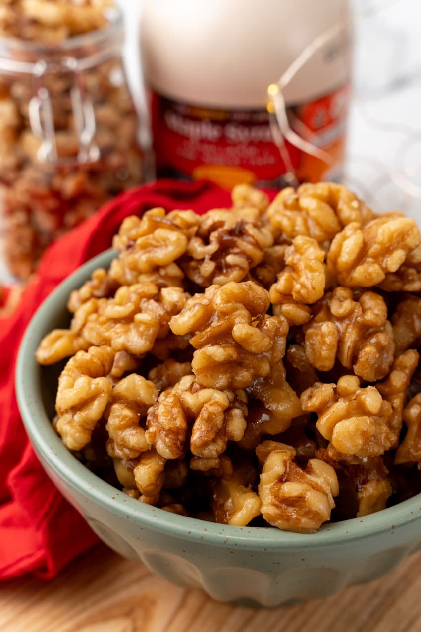 slow cooker maple walnuts in a small gray bowl
