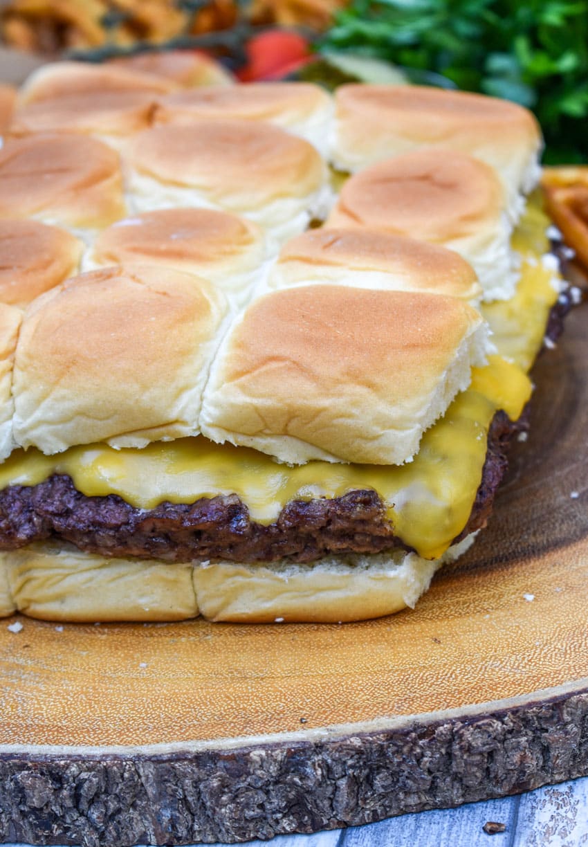 easy cheeseburger sliders on a wooden cutting board