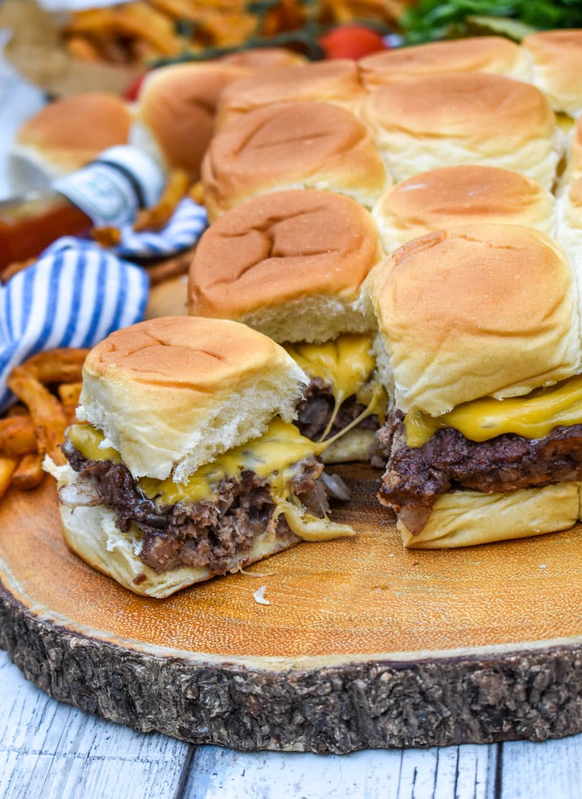 easy cheeseburger sliders on a wooden cutting board