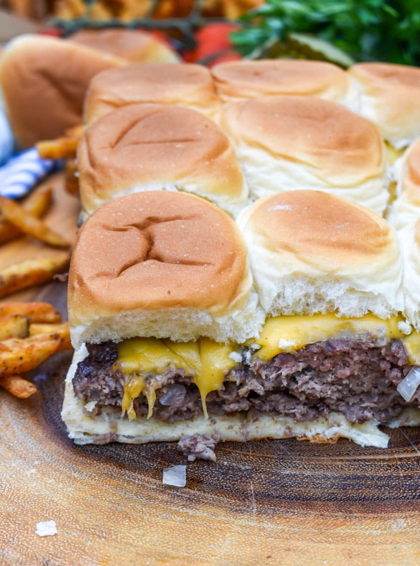 easy cheeseburger sliders on a wooden cutting board