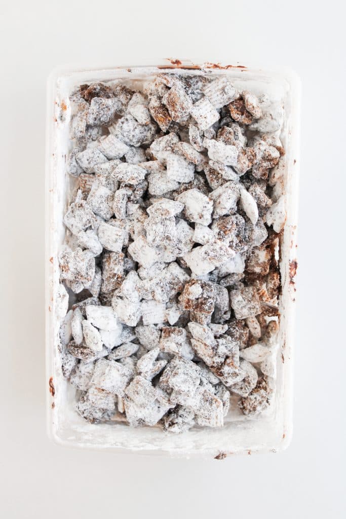 homemade s'mores muddy buddies in a large white container