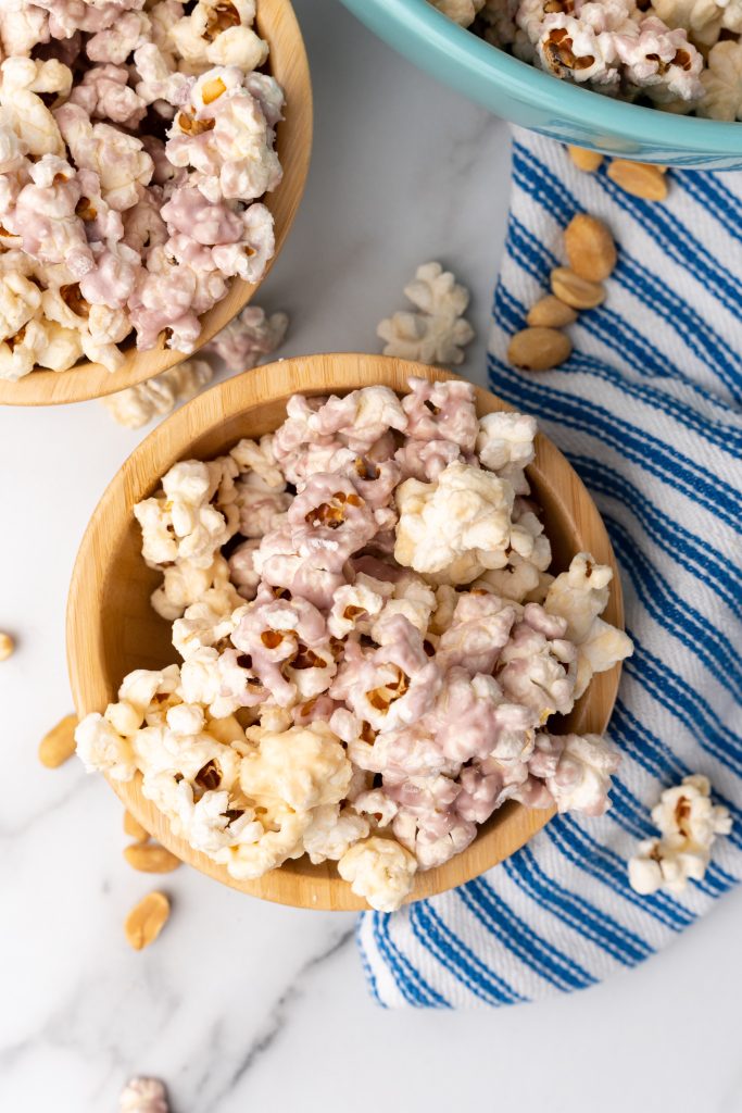 peanut butter and jelly popcorn in two wooden bowls