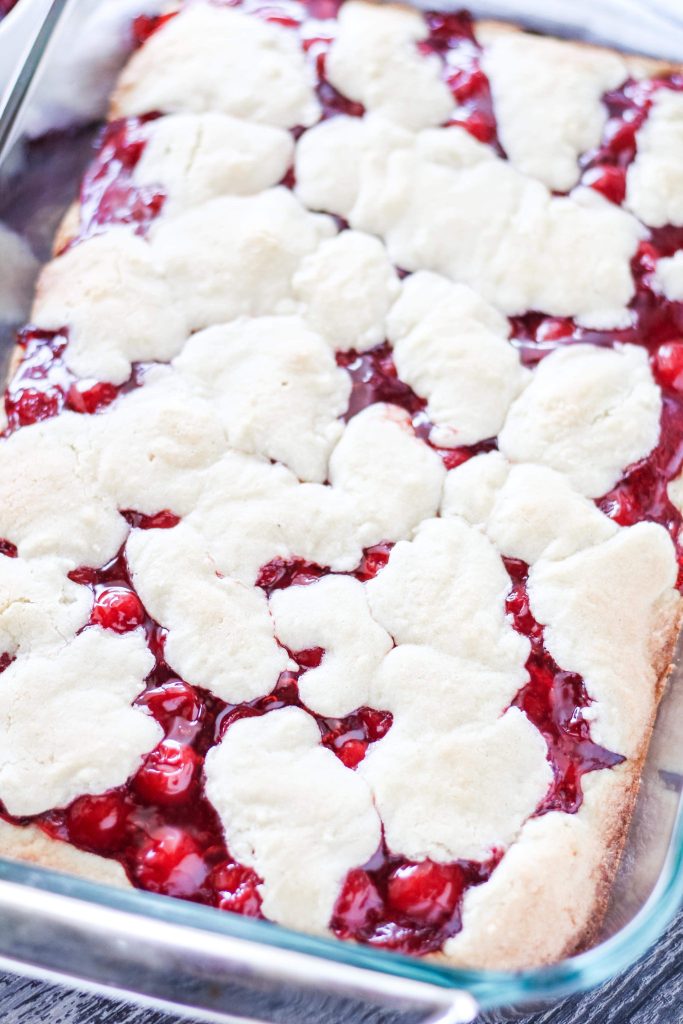 a batch of cherry pie bars baked in a 9x13 baking dish