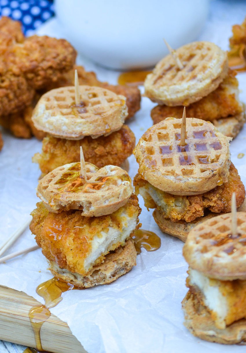 chicken and waffle sliders on white parchment paper