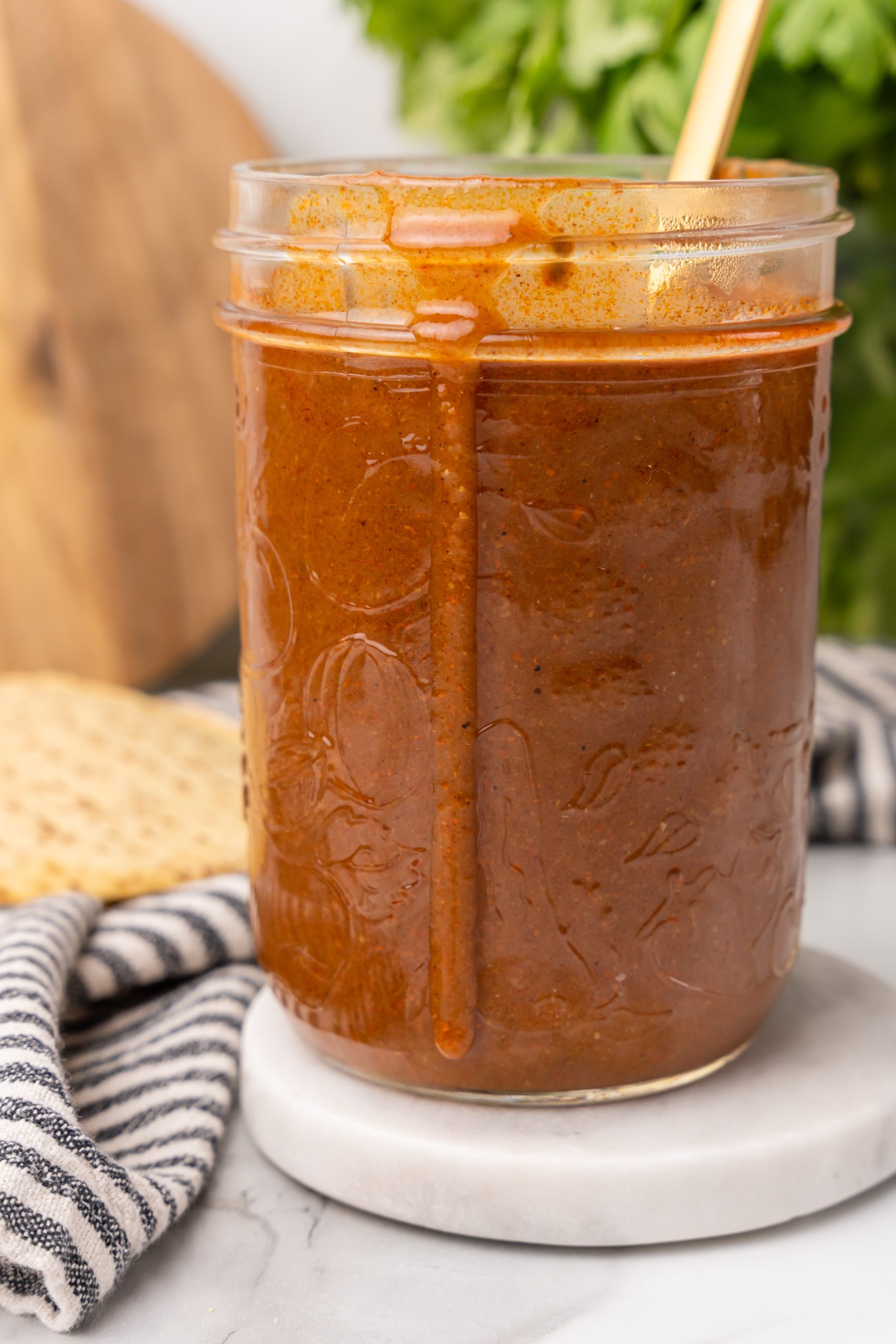 red enchilada sauce in a glass mason jar
