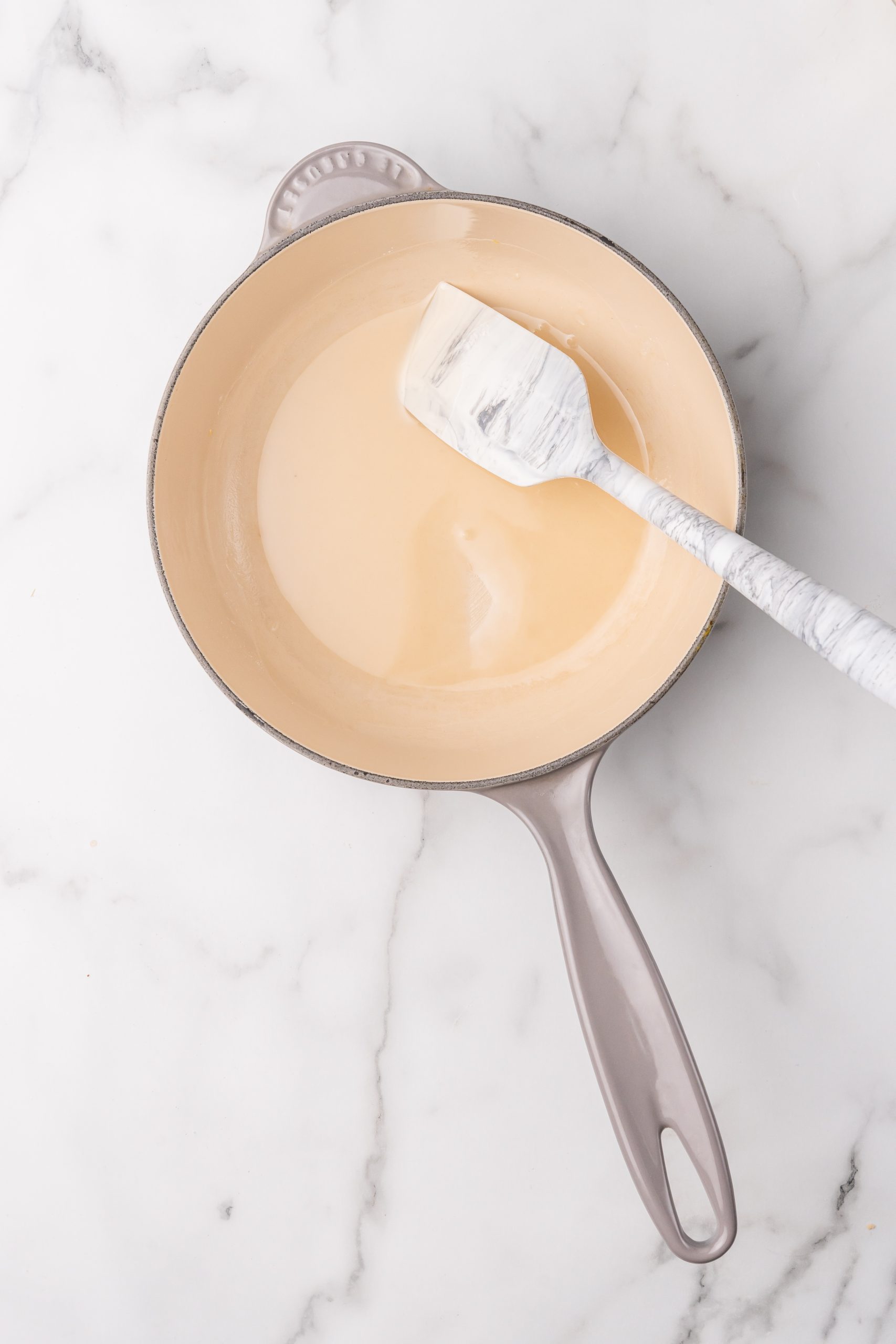 a roux in a small gray sauce pan