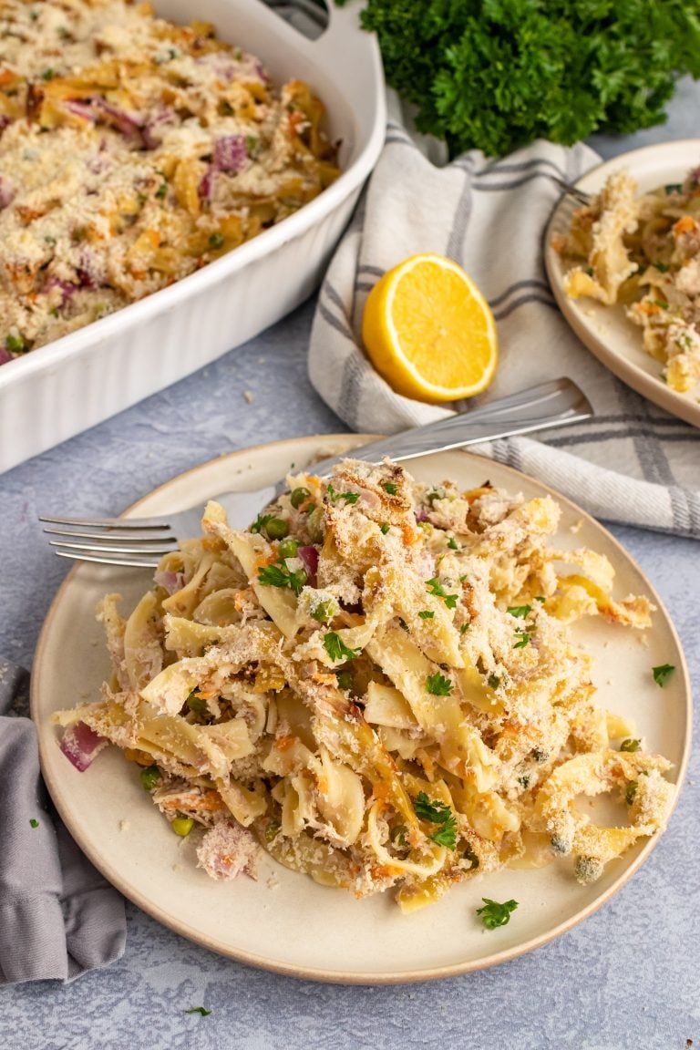 creamy tuna noodle casserole on a cream colored plate