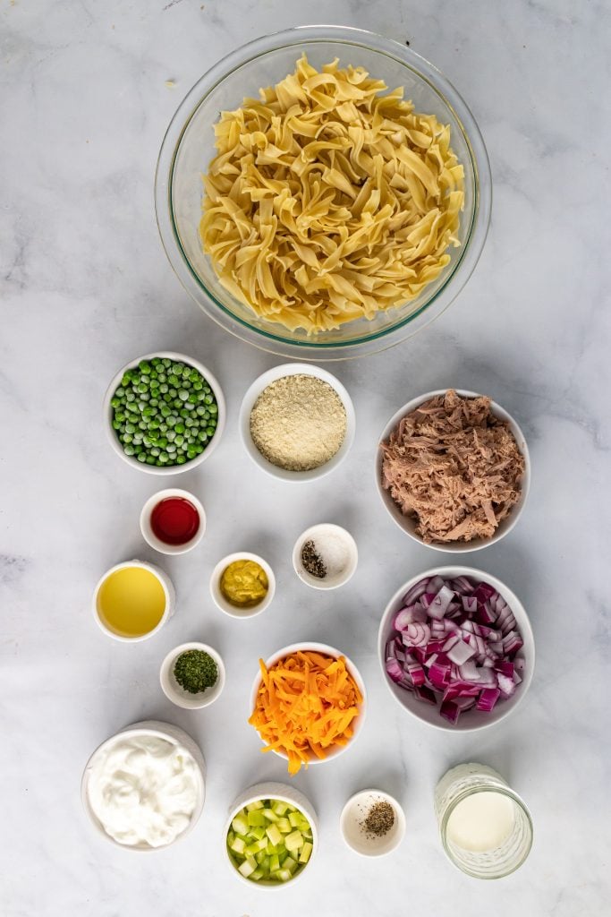 overhead image showing all of the measure ingredients needed to make a creamy tuna noodle casserole