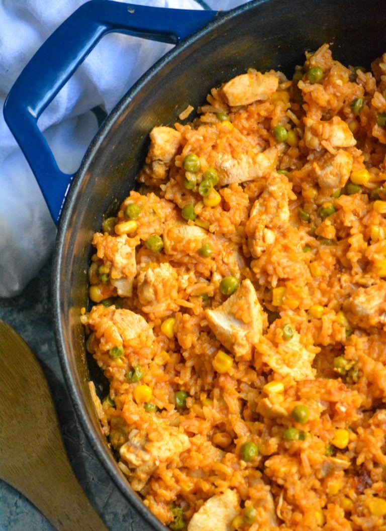 ONE POT MEXICAN CHICKEN AND RICE IN A BLUE CAST IRON SKILLET