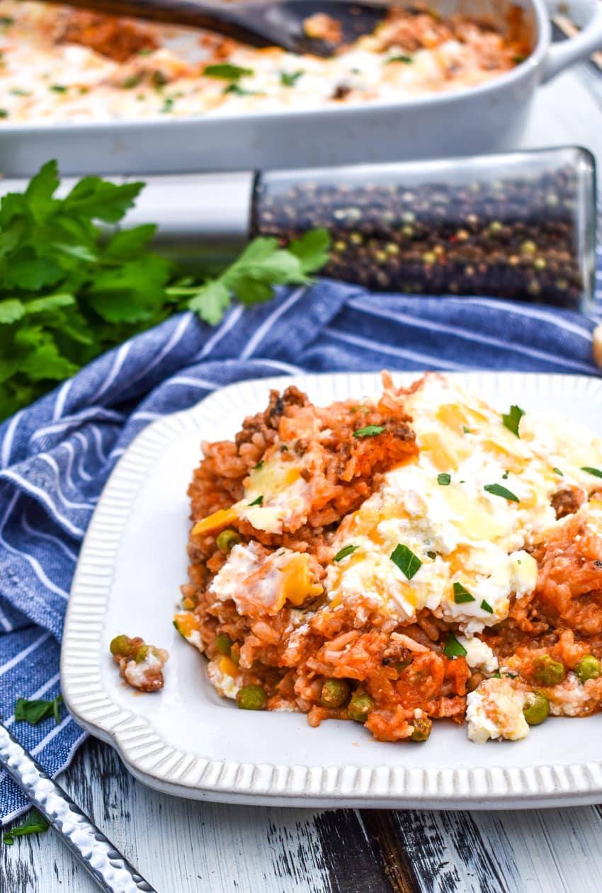 cheesy ground beef and rice casserole on a white plate