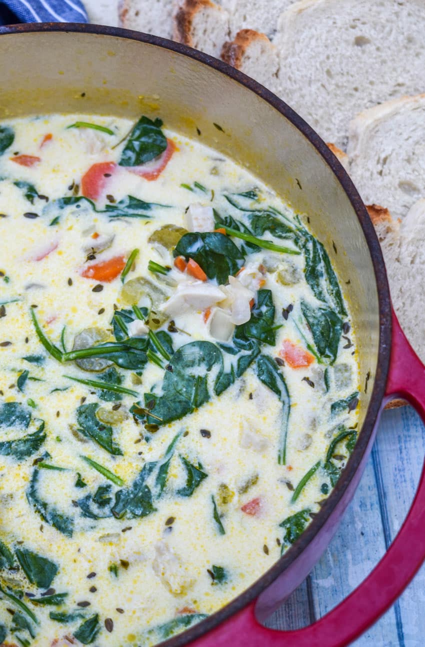 chicken florentine soup in a large red dutch oven