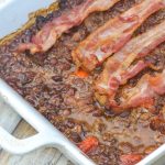 ground beef and baked bean casserole in a white baking dish