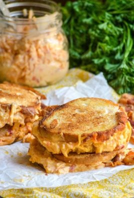 pimento cheese grilled cheese sandwiches shown on crinkled white parchment paper
