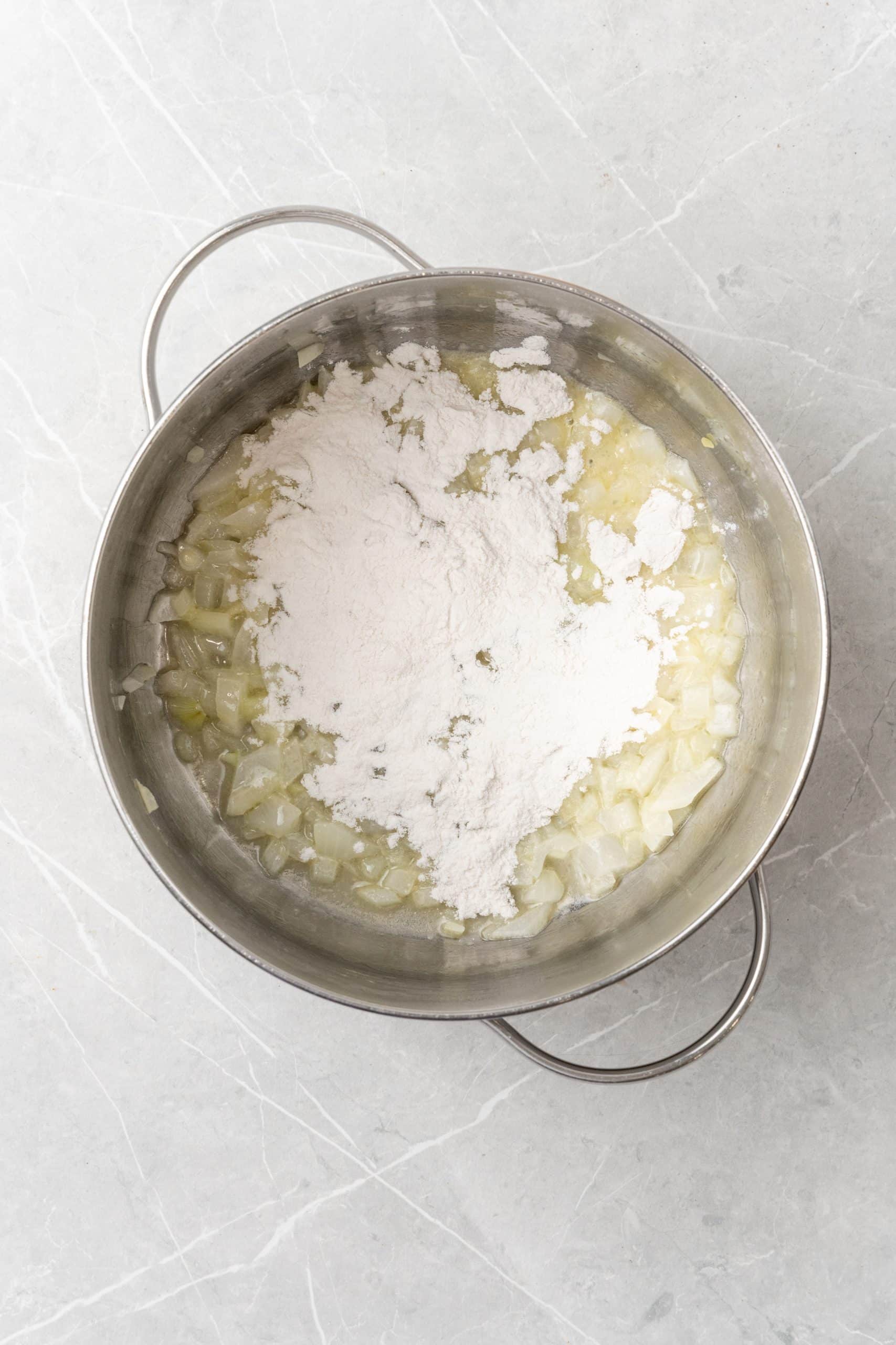 flour and sauteed onions in butter in a silver pot