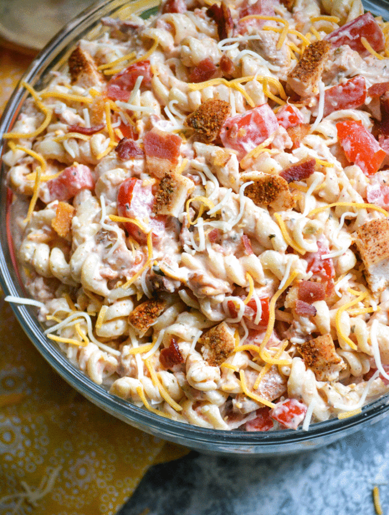 Southwestern chicken pasta salad served in a large glass mixing bowl