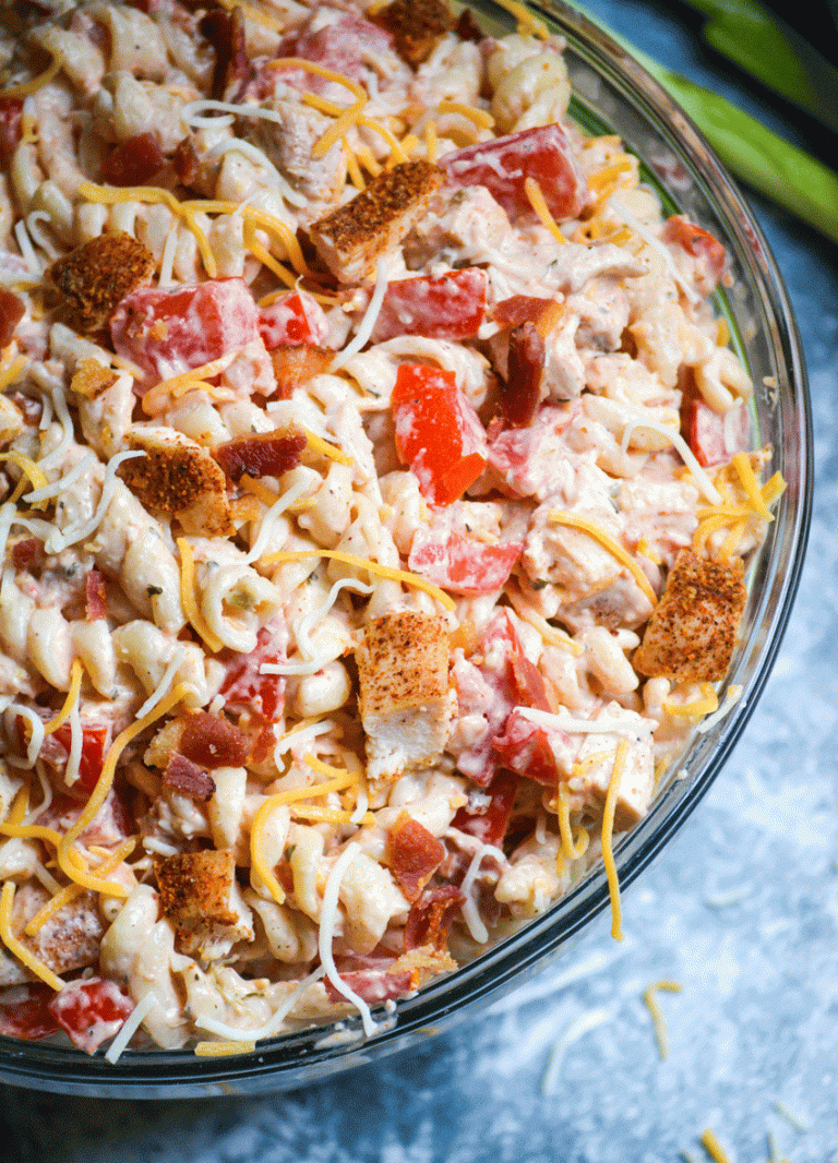 Southwestern chicken pasta salad served in a large glass mixing bowl