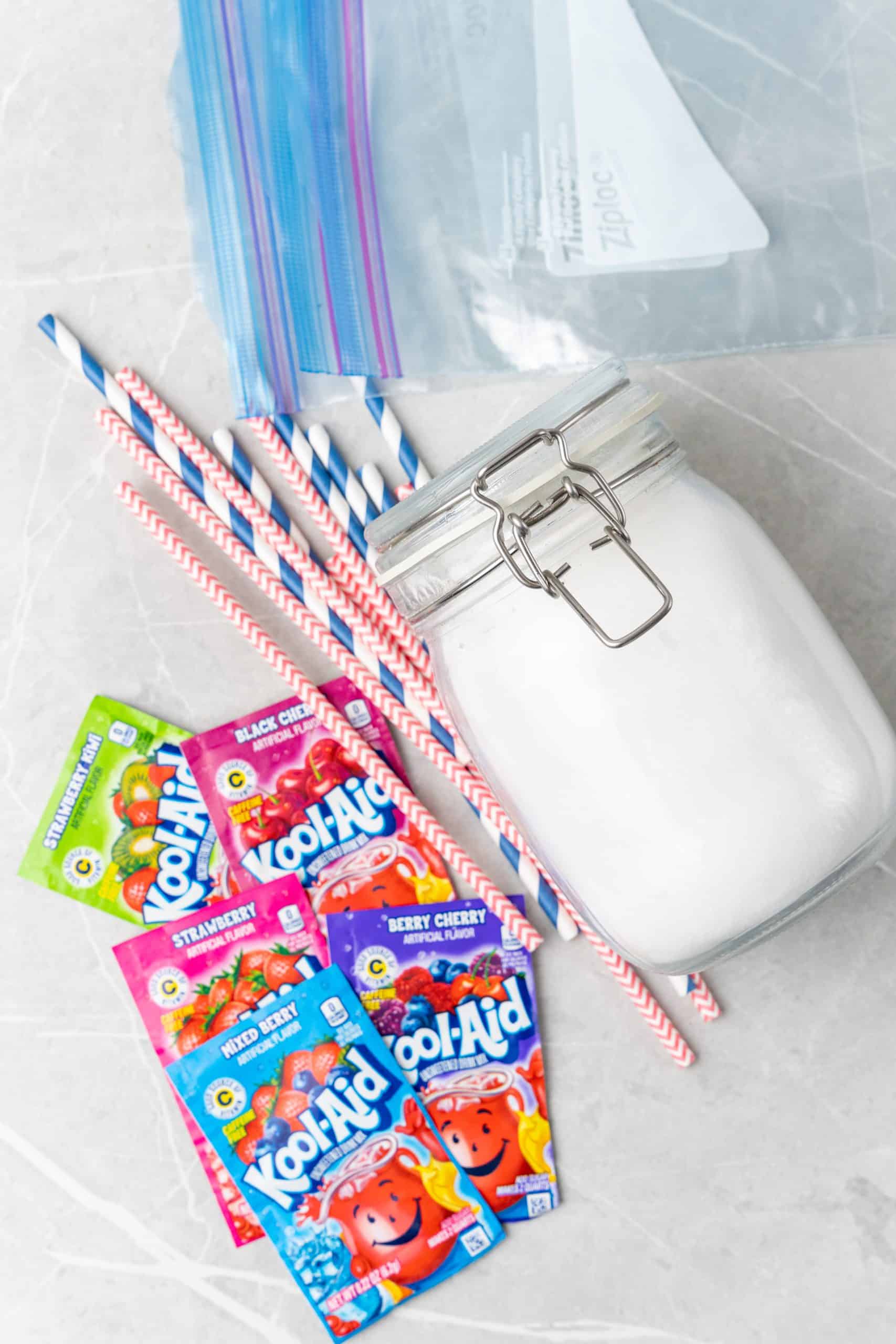 an overhead image showing the ingredients needed to make a batch of homemade pixie sticks