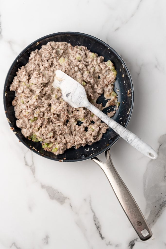 creamy ground beef mixture in a large black skillet