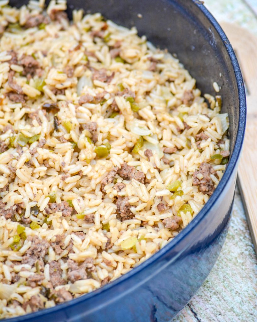 one pot dirty rice in a blue cast iron enameled pot