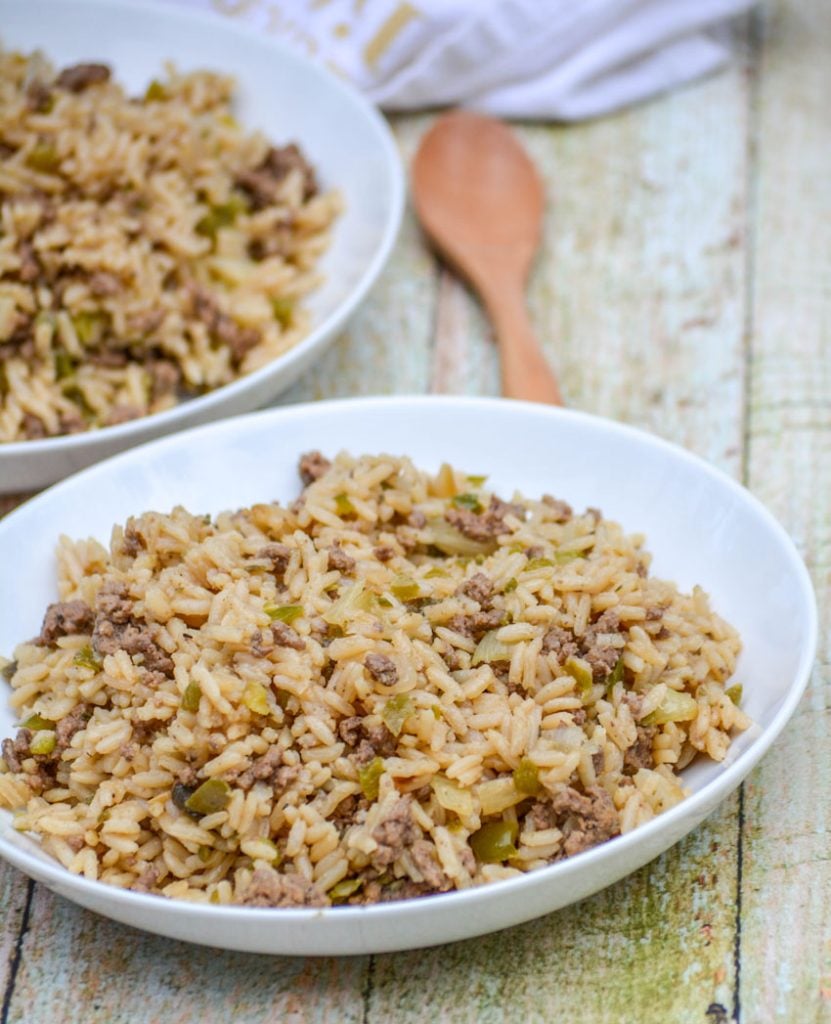 one pot dirty rice served on white plates