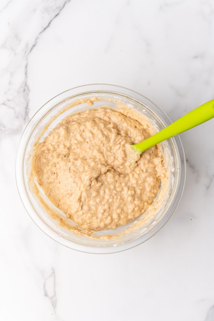 applesauce oatmeal muffin batter in a glass mixing bowl