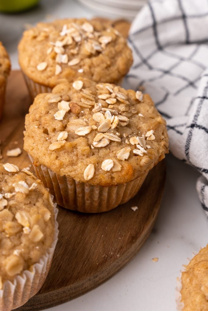 applesauce oat muffins on a brown cutting board